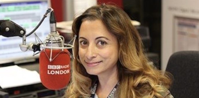 Jasmine Dotiwala on air at a BBC Radio London microphone